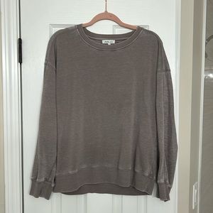 Tan long sleeve pullover. waffle material on back.